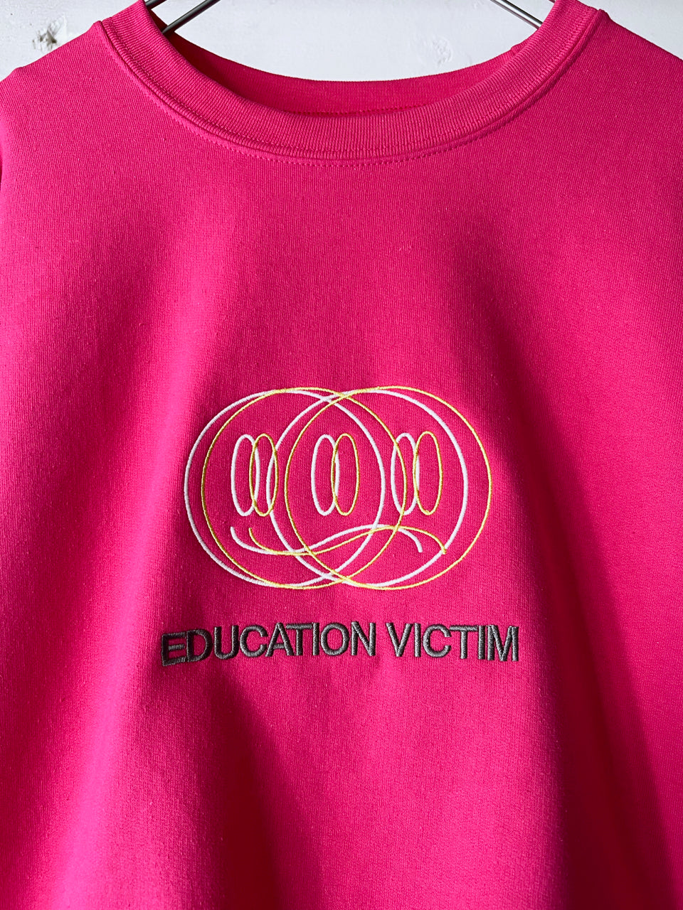 GAMBLING EDUCATION VICTIM CREWNECK SWEATSHIRT PNK