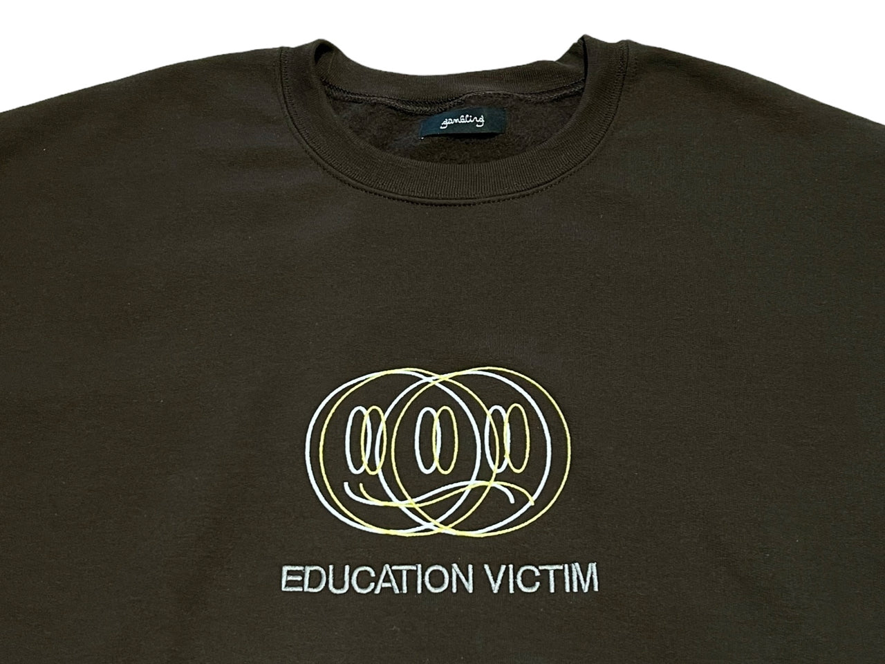 GAMBLING EDUCATION VICTIM CREWNECK SWEATSHIRT BRN